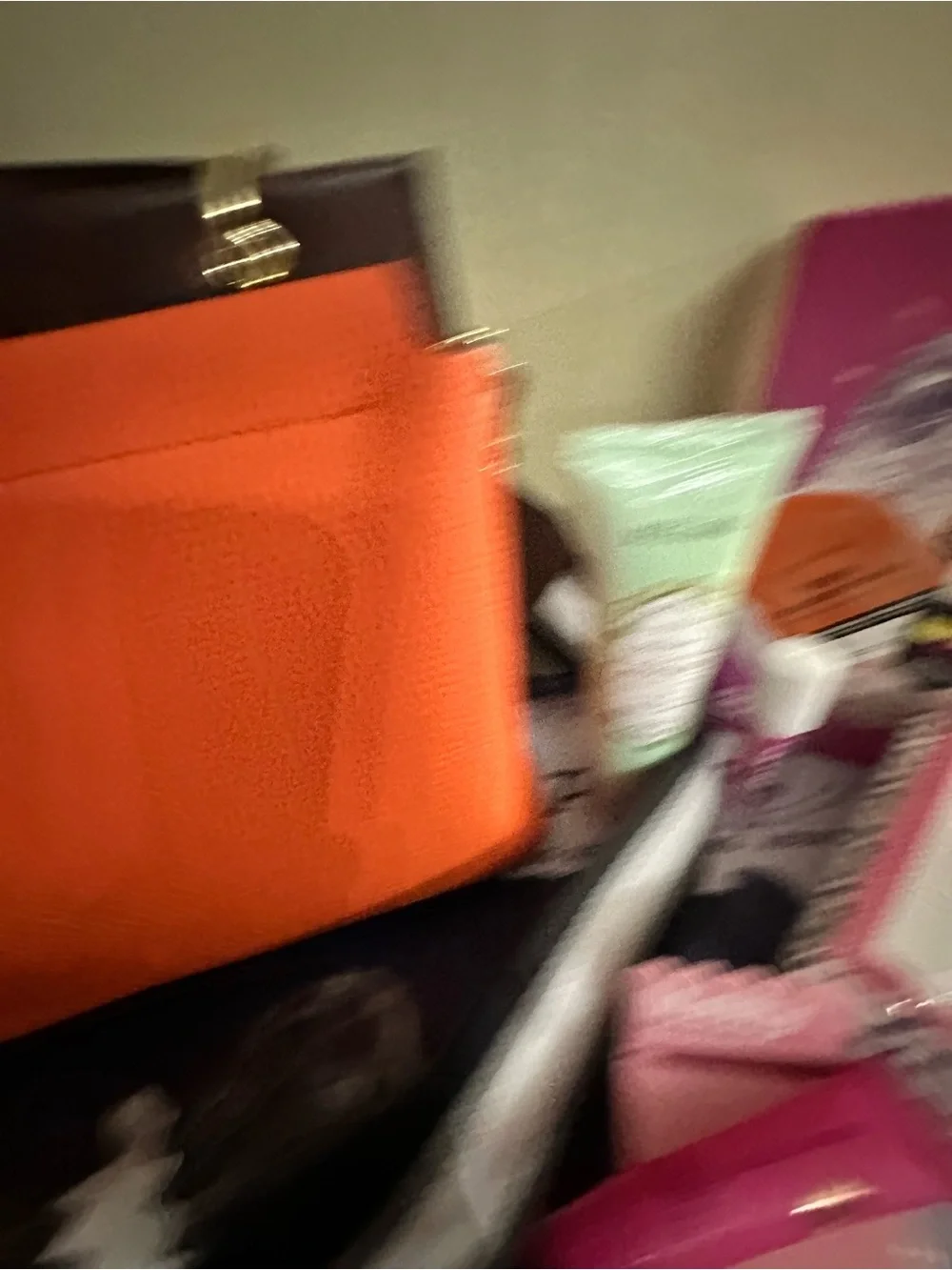 Orange hand Bag with Dark Brown Trim two crossbody straps..filled